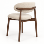 Bight dining chair — rounded upholstered back on a walnut frame