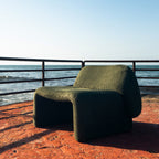 Furrow Chair seen from the front at a distance, showing the full outline of the chair.