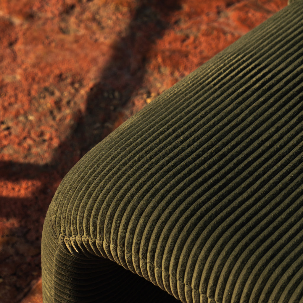 Close view of the fine, narrow olive corduroy cord on the Furrow Chair.